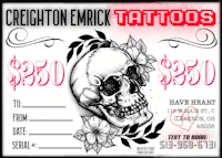 a tattoo card with a skull and flowers