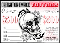 a tattoo gift card with a skull and flowers